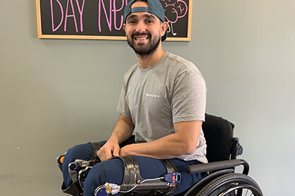 photo of Roel Benavides sitting in his wheelchair