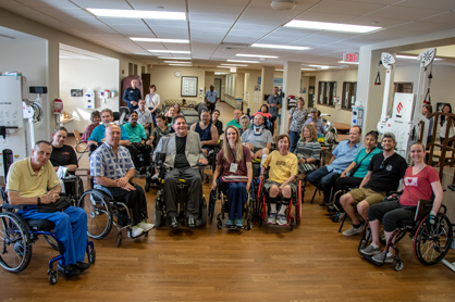 A group of patients sitting together in wheelchairs.